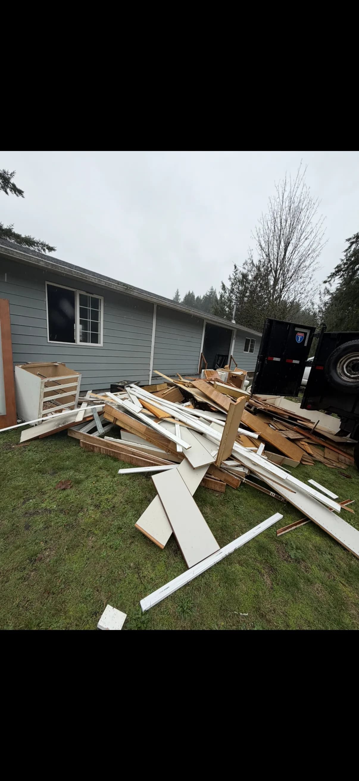 Demolition and debris piled outside for removal