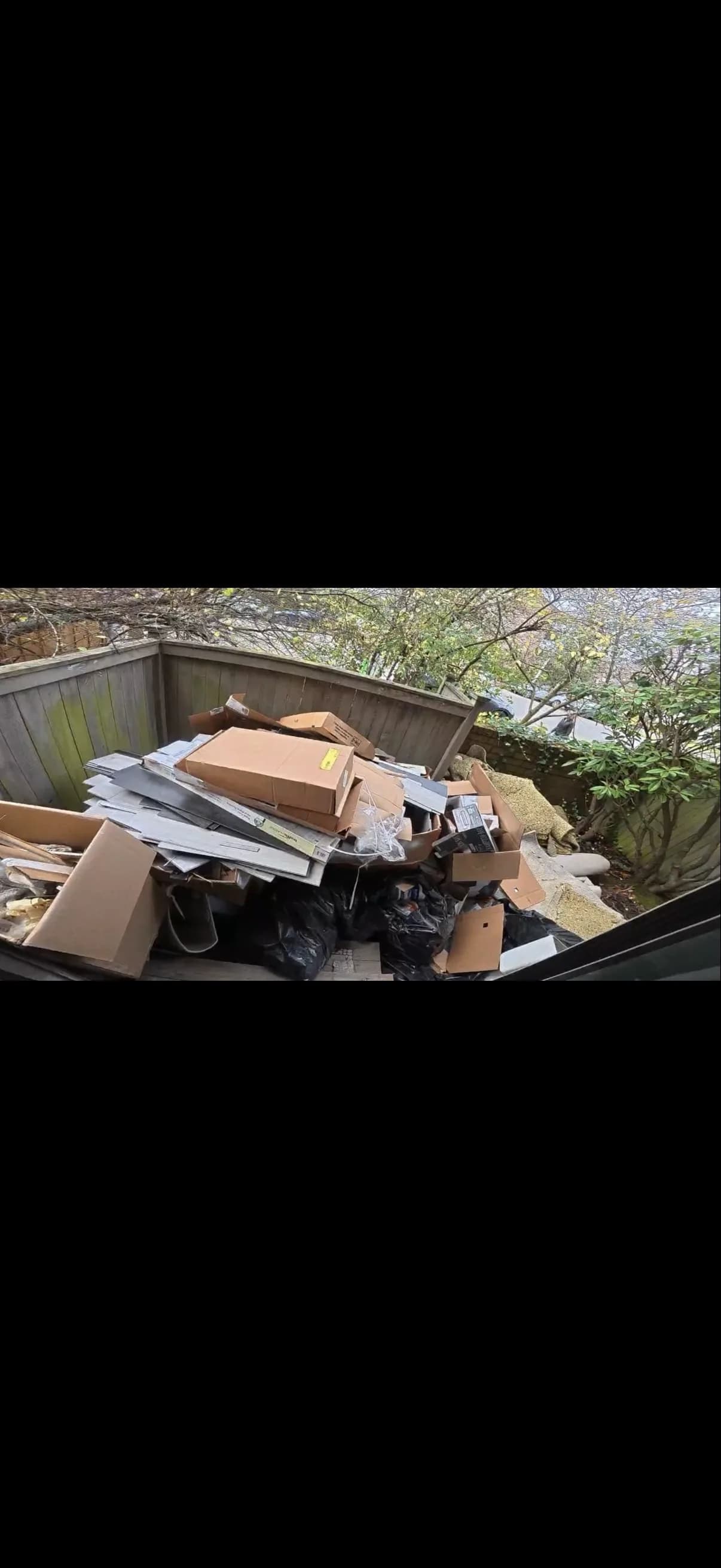 Truck dumping junk at disposal facility